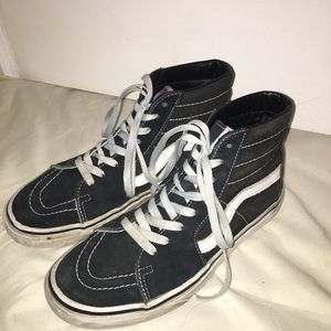 Black and white high top vans